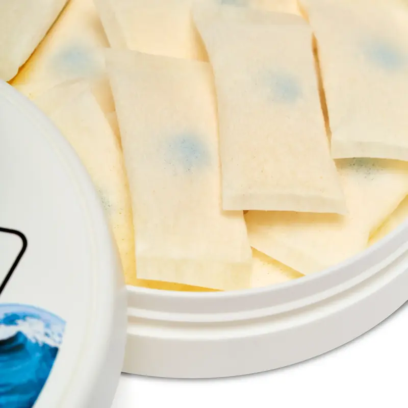 Close-up of LUCY Breakers pouches in an open tin